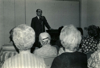 Town Hall Meeting, Item 1, front: Masaru Nambu, Executive Director of JASC, is at the podium