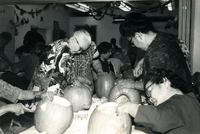 Issei Social Program, Item 10, front: Work Center people carve Halloween pumpkins