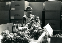 Workshop [Senior Work Center], Item 3, front: Worker with artificial flower arrangements