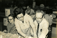 Senior Work Center [Workers and New Year's Party], Item 9, front: Mary Fukui, work center supervisor (standing)