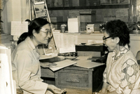 Senior Work Center [Workers and New Year's Party], Item 2, front: Haru Tanaka, workshop supervisor (left)