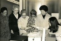 Issei Social Program Sign-up, Item 1, front: From left: Two unidentified women, Mrs. Sato, Mrs. Karikomi, Mrs. Okamoto, and Kathy Harano, JASC office secretary