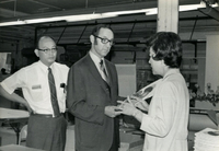 Workshop [Senior Work Center], Item 22, front: Mr. Nambu (far left) and workshop supervisor Pauline Yoshioka (far right) give Dr. Bruce Douglas, Illinois state representative, a guided tour of the work center