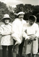 Annual [Community] Picnic and Workshop [Senior Work Center], Item 2, front: Work Center supervisor Mike Nishi (center) models tissue "garment" made by Issei