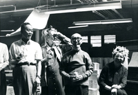 Blood Assurance, Communal Living, Issei Work Center, Body Dynamics, Annual Community Picnic, and Market Day, Item 31, front: Easter Parade participants made hats and ties from materials available in the work center. Mary Fukui (at piano)