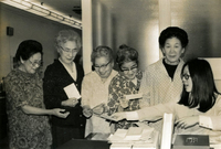 Issei Social Program Sign-up, Item 2, front: From left: Two unidentified women, Mrs. Sato, Mrs. Karikomi, Mrs. Okamoto, and Kathy Harano, JASC office secretary