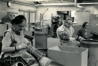 Workshop [Senior Work Center], Item 2, front: Mental health clients at workshop make metal scrubbers