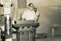 New Year's Party, Item 23, front: Frank Hattori at the microphone