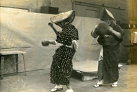 New Year's Party, Item 22, front: Mrs. Monma (right) performs at the New Year's party